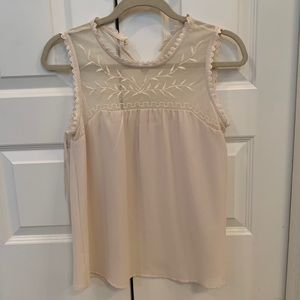 White embroidered sleeveless blouse